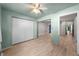 Bedroom with a light green color scheme, wood-look floors, and large closet at 426 32Nd N Ave # 102E, St Petersburg, FL 33704