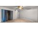 Bedroom featuring wood-look flooring, a standard closet with blue curtains, and neutral paint at 426 32Nd N Ave # 102E, St Petersburg, FL 33704