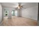 Bright bedroom features a ceiling fan, wood-look floors, and neutral wall color at 426 32Nd N Ave # 102E, St Petersburg, FL 33704