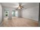 Cozy bedroom featuring light wood floors, fan, and closet for a relaxing and organized space at 426 32Nd N Ave # 102E, St Petersburg, FL 33704