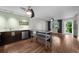 Modern kitchen with stainless steel appliances, quartz countertops, and wood-style flooring at 426 32Nd N Ave # 102E, St Petersburg, FL 33704