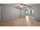 Inviting living room with wood floors, fan, and plenty of space for comfortable living and entertaining at 426 32Nd N Ave # 102E, St Petersburg, FL 33704