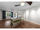 Spacious living room with wood floors, fan, and natural light creating a cozy and inviting atmosphere at 426 32Nd N Ave # 102E, St Petersburg, FL 33704