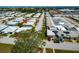 Aerial view of a well-maintained home in a peaceful neighborhood with mature trees at 5427 Springwood Blvd # 5427, Pinellas Park, FL 33782