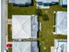 Aerial view showcases home's location and layout within the neighborhood, highlighting the roof's condition at 5427 Springwood Blvd # 5427, Pinellas Park, FL 33782