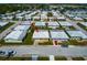Aerial view of community, featuring well-maintained homes, manicured lawns, and a peaceful neighborhood setting at 5427 Springwood Blvd # 5427, Pinellas Park, FL 33782
