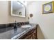 Stylish bathroom vanity featuring a granite countertop, decorative faucet, and classic design at 5427 Springwood Blvd # 5427, Pinellas Park, FL 33782