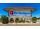 Community entrance sign displaying the name Springwood II, beautifully landscaped with stone accents and lush greenery at 5427 Springwood Blvd # 5427, Pinellas Park, FL 33782