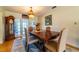 Elegant dining room boasts hardwood floors, traditional decor, and a beautiful chandelier at 5427 Springwood Blvd # 5427, Pinellas Park, FL 33782