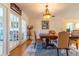 Elegant dining room with hardwood floors, traditional furniture, and an ornate chandelier at 5427 Springwood Blvd # 5427, Pinellas Park, FL 33782