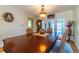 Formal dining room featuring a wood table, decorative chandelier, and French doors to the outside at 5427 Springwood Blvd # 5427, Pinellas Park, FL 33782