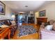 Comfortable living room with hardwood floors, leather sofa, and a decorative fireplace at 5427 Springwood Blvd # 5427, Pinellas Park, FL 33782