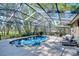 Inviting pool area features lush landscaping and outdoor furniture for relaxation at 6229 Wild Orchid Dr, Lithia, FL 33547