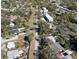 Aerial view of the property with surrounding trees, houses, and the street it resides on at 6327 Emerson S Ave, St Petersburg, FL 33707
