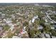 Aerial view of the property in a neighborhood setting with lush trees and nearby urban amenities at 6327 Emerson S Ave, St Petersburg, FL 33707