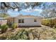 A cozy backyard with mature trees and a small patio area perfect for outdoor seating at 6327 Emerson S Ave, St Petersburg, FL 33707