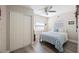 Comfortable bedroom with ceiling fan, closet and windows offering ample natural light at 6327 Emerson S Ave, St Petersburg, FL 33707