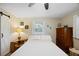 A traditional bedroom with neutral walls, hardwood floors, and natural light at 6327 Emerson S Ave, St Petersburg, FL 33707