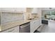 Well-lit kitchen featuring stainless steel appliances, granite countertops, and decorative backsplash at 6327 Emerson S Ave, St Petersburg, FL 33707