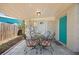 Covered patio with outdoor seating and a turquoise door at 6327 Emerson S Ave, St Petersburg, FL 33707