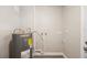 Utility room with hot water tank and grey flooring at 6327 Emerson S Ave, St Petersburg, FL 33707