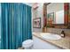 Cozy bathroom with blue shower curtain and unique decor at 7515 37Th E Ave, Palmetto, FL 34221