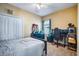 Bedroom with carpet flooring, and a nearby computer desk with gaming setup at 7515 37Th E Ave, Palmetto, FL 34221