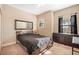 Neutral bedroom featuring a carpeted floor, dresser, and a large mirror at 7515 37Th E Ave, Palmetto, FL 34221