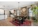 Dining area features a large floral wall hanging, industrial-style table, and bench seating at 7515 37Th E Ave, Palmetto, FL 34221