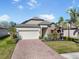 Charming single-Gathering home boasting well-manicured landscaping and a brick driveway at 7515 37Th E Ave, Palmetto, FL 34221