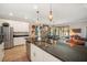 Open kitchen with a large island, stainless steel appliances, and backyard views at 7515 37Th E Ave, Palmetto, FL 34221