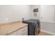 Well-equipped laundry room with modern washer and dryer and countertop space for folding at 7515 37Th E Ave, Palmetto, FL 34221