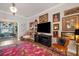 Eclectic living room with statement art, colorful rug and lots of natural light at 7515 37Th E Ave, Palmetto, FL 34221