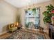 Bright sitting room featuring indoor plants, natural light, and vintage furniture at 7515 37Th E Ave, Palmetto, FL 34221