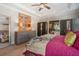 Bright main bedroom showcases a decorative wall mirror and ensuite bath at 7515 37Th E Ave, Palmetto, FL 34221
