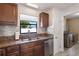 Updated kitchen featuring granite countertops, backsplash and stainless steel appliances at 7874 14Th N Way, St Petersburg, FL 33702