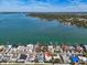 Waterfront homes line the canal in this aerial shot, with docks and stunning bay views at 7942 Causeway N Blvd, St Petersburg, FL 33707