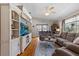 Inviting living room with hardwood floors, vaulted ceilings, and a ceiling fan for comfort at 95 Georgia Ave, Crystal Beach, FL 34681