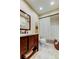 Bathroom featuring a vanity with sink, toilet, shower with curtain, and decor at 9769 86Th Ave # 9769, Seminole, FL 33777