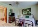 Cozy bedroom featuring a large bed, a wooden dresser with a TV on it, and an ensuite bathroom at 9769 86Th Ave # 9769, Seminole, FL 33777