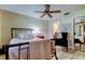 Cozy bedroom with queen bed, ceiling fan, and closet for ample storage at 9769 86Th Ave # 9769, Seminole, FL 33777