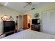 Well-lit bedroom featuring an ensuite bathroom, stylish decor, and functional furniture at 9769 86Th Ave # 9769, Seminole, FL 33777