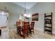 The dining room is adjacent to the kitchen, with wood floors and plenty of natural light at 9769 86Th Ave # 9769, Seminole, FL 33777