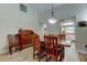 Open dining room features wood floors and a view to the kitchen at 9769 86Th Ave # 9769, Seminole, FL 33777
