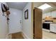 Inviting entryway next to the kitchen showcases the doorway with coat hooks at 9769 86Th Ave # 9769, Seminole, FL 33777