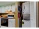 The laundry area features a stacked washer and dryer near the kitchen area at 9769 86Th Ave # 9769, Seminole, FL 33777