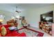 Open-concept living room, showcasing the dining area, TV, and comfortable seating at 9769 86Th Ave # 9769, Seminole, FL 33777