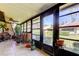 Enclosed patio with tile floor, ceiling fan, lots of windows and space for indoor plants at 9769 86Th Ave # 9769, Seminole, FL 33777