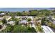 Lush aerial view showing various houses in a waterside community at 1037 Jamaica Way, Tarpon Springs, FL 34689