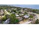 Extensive aerial shot of a waterfront community with various houses and lush landscapes at 1037 Jamaica Way, Tarpon Springs, FL 34689